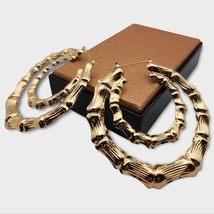 Hollow Gold Tone Earrings Bone Detail